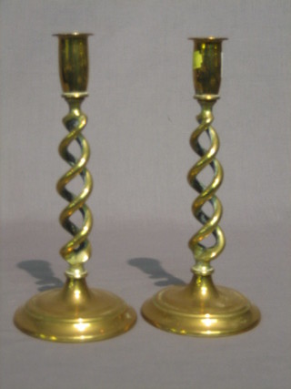 A pair of brass spiral candlesticks 10"