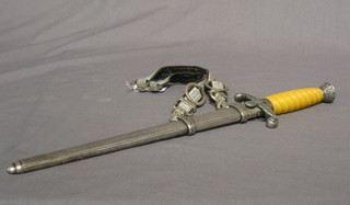 A WWII Nazi German Heer dagger, the double edge blade marked Alcoso Solinger and with scabbard