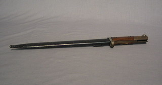 A bayonet complete with metal scabbard