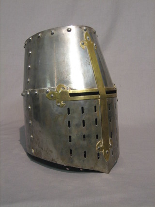 A reproduction polished steel and brass Knight's helmet
