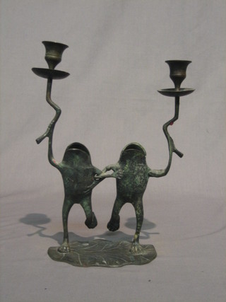 A pair of 20th Century bronze candlesticks in the form of standing frogs 12"
