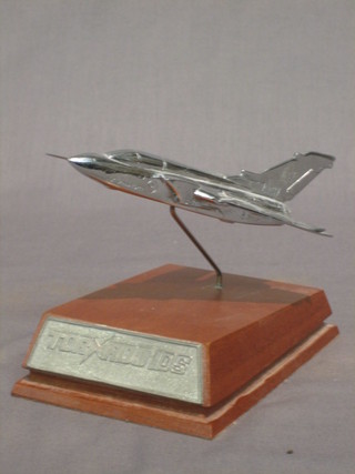 A chromium plated table model of an RSAF Aircraft Tornado on an oak base 6"
