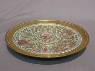 A 19th/20th Century French embossed copper and brass dish, the base marked AB Paris, 13"