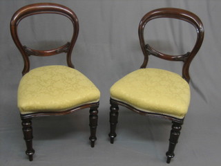 A set of 6 20th Century Victorian style mahogany balloon back dining chairs with upholstered seats, raised on turned supports