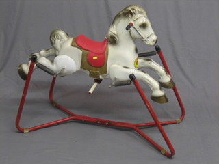 A Mobo pressed metal rocking horse