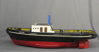 A wooden model of The Ocean Going Tug Derland 57"