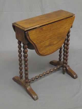 A Victorian mahogany Sutherland table raised on bobbin turned supports 18"