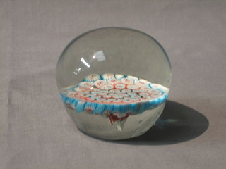 A circular Millefiori style paperweight 2 1/2"