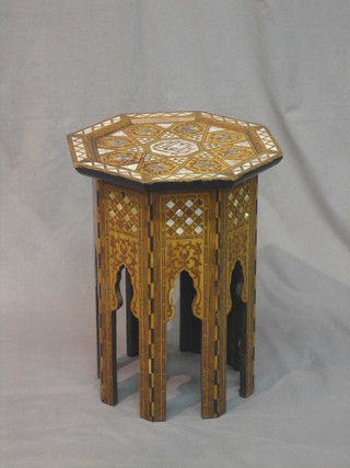 An octagonal Eastern hardwood and inlaid mother of pearl sewing box with hinged lid 16"