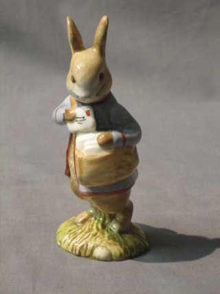 A Beswick Royal Doulton Beatrix Potter figure  Peter with Postbag, black mark 1996