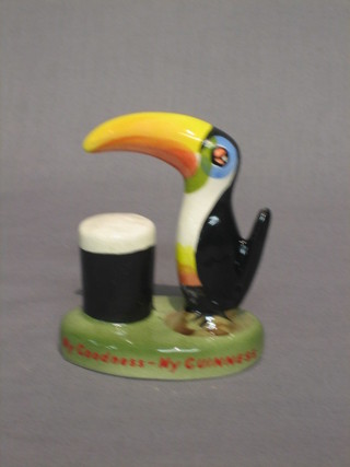 A Carltonware figure of a standing Toucan with pint of Guinness "Guinness is Good For You", the base with black Carltonware mark