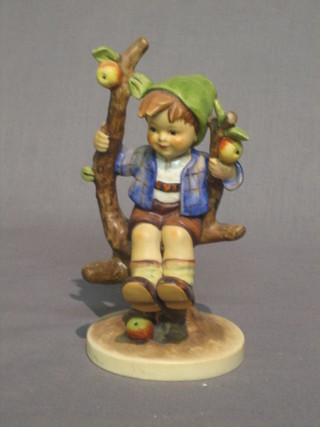 A Goebel figure of a boy in an apple bower 6", base marked Goebel 142/1 (f and r)