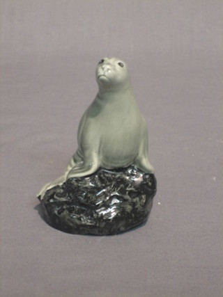 A Wade whiskey decanter for Peter Thomson in the form of a sea lion