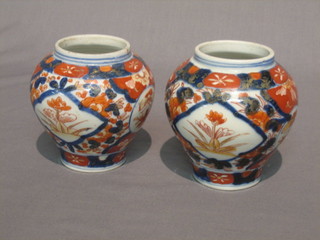 A pair of 19th Century Japanese Imari porcelain vases of baluster form 4"