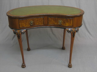 A 20th Century Georgian style walnut kidney shaped writing table, fitted 2 drawers, raised on cabriole supports 42"