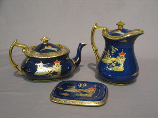 A Carltonware blue glazed teapot and stand and a matching hotwater jug with chinoiserie decoration, the base with black Carltonware mark 23645773