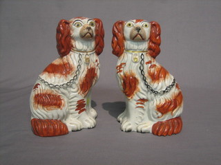 A pair of Staffordshire figures of seated Spaniels 8" (1 with crack to back