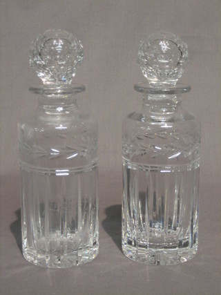 A pair of cut glass decanters and stoppers 9"
