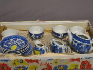 A 19th Century 10 piece blue and white pattern childs tea service comprising teapot, lidded sucrier, cream jug, 4 cups and saucers (1 saucer cracked) and 3 dinner plates