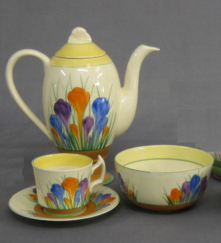 A 12 piece Clarice Cliff Crocus pattern coffee service comprising coffee pot (chip to inner lid), sugar bowl, 4 cups and 6 saucers