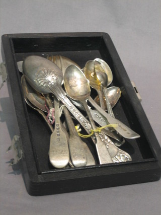 2 silver table spoons, 2 silver forks, a silver butter knife, 10 various tea spoons, 12 ozs