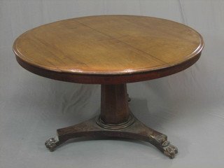 A 19th Century circular snap top breakfast table raised on chamfered column with triform base 47"