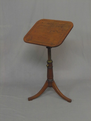 A 19th Century inlaid mahogany adjustable reading/music stand, raised on tripod supports 18"