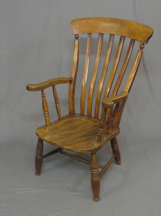 A 19th Century elm stick and rail back kitchen carver chair (cut down)