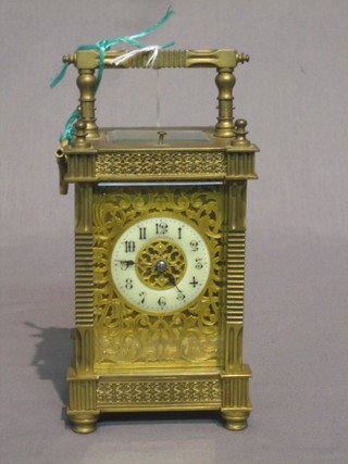 A French 19th Century 8 day striking carriage clock with enamelled dial and replacement platform, contained in a gilt case