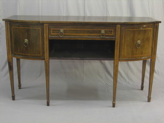 A Georgian style mahogany bow front sideboard fitted 1 long drawer, flanked by a pair of cupboards raised on square tapering supports ending in spade feet 64"