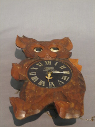 A Japanese 1930's novelty wall clock in the form of a blinking owl by Tezeka Clock Company