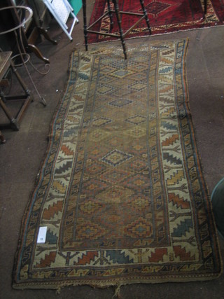 A Caucasian rug with all-over geometric design within multi-row borders 94" x 44"