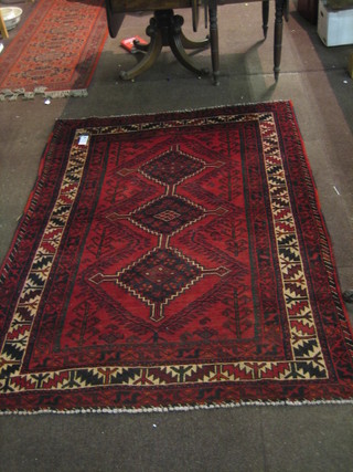 A contemporary red and black ground Shiraz rug with 3 medallions to the centre within a multi-row border 82" x 61"