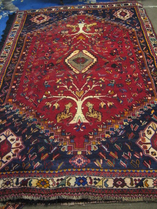 A contemporary red ground and floral pattern Shiraz rug 118" x 82"