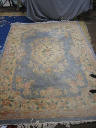 A Chinese blue and floral pattern rug (some staining) 108" x 73"