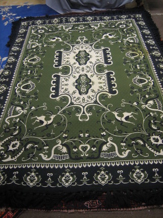 A Mediterranean style green and black rug 110" x 76"