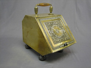 A 19th Century embossed brass coal box with hinged lid