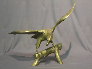A pair of brass figures of eagles with outstretched wings  26"