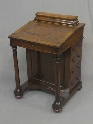 A William IV rosewood Davenport with hinged lid, the pedestal fitted 4 long drawers with column to the sides 22"