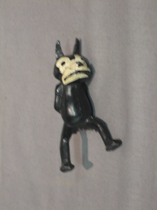 A lead figure of a standing figure of Felix The cat (tail f)