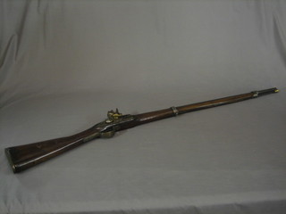 An 18th/19th Century flint lock musket, the lock engraved a rampant stag with 33" barrel complete with ram rod