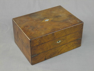 A Victorian figured walnut writing slope with hinged lid with a diamond shaped mother of pearl inlay, 12"