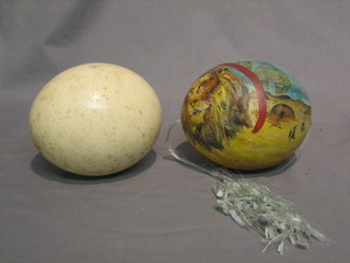 A painted ostrich egg and 1 other