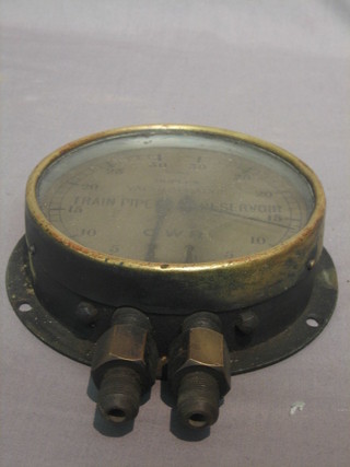 A Great Western Railway train pipe reservoir vacuum gauge contained in a brass frame 6", complete with glass