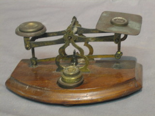 A pair of brass postage scales