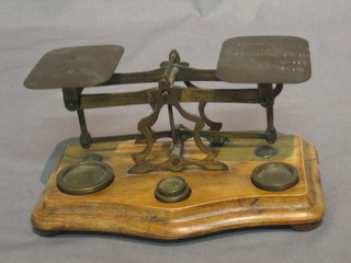 A pair of postage scales complete with weights