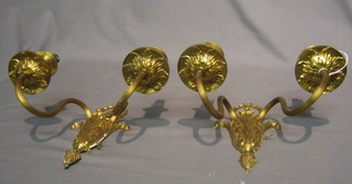 A pair of gilt metal twin light wall brackets