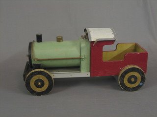 A childs wooden push along model of a train 24"
