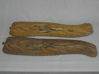 A pair of carved Eastern plaques depicting fish and birds 41"