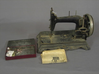An antique sewing machine - "The Improved Sewing Machine"? raised on a 15" shaped iron base